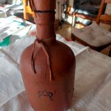 Leather covered bottle with stopper