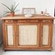 Classic vintage buffet with 3 doors in wood and raffia.