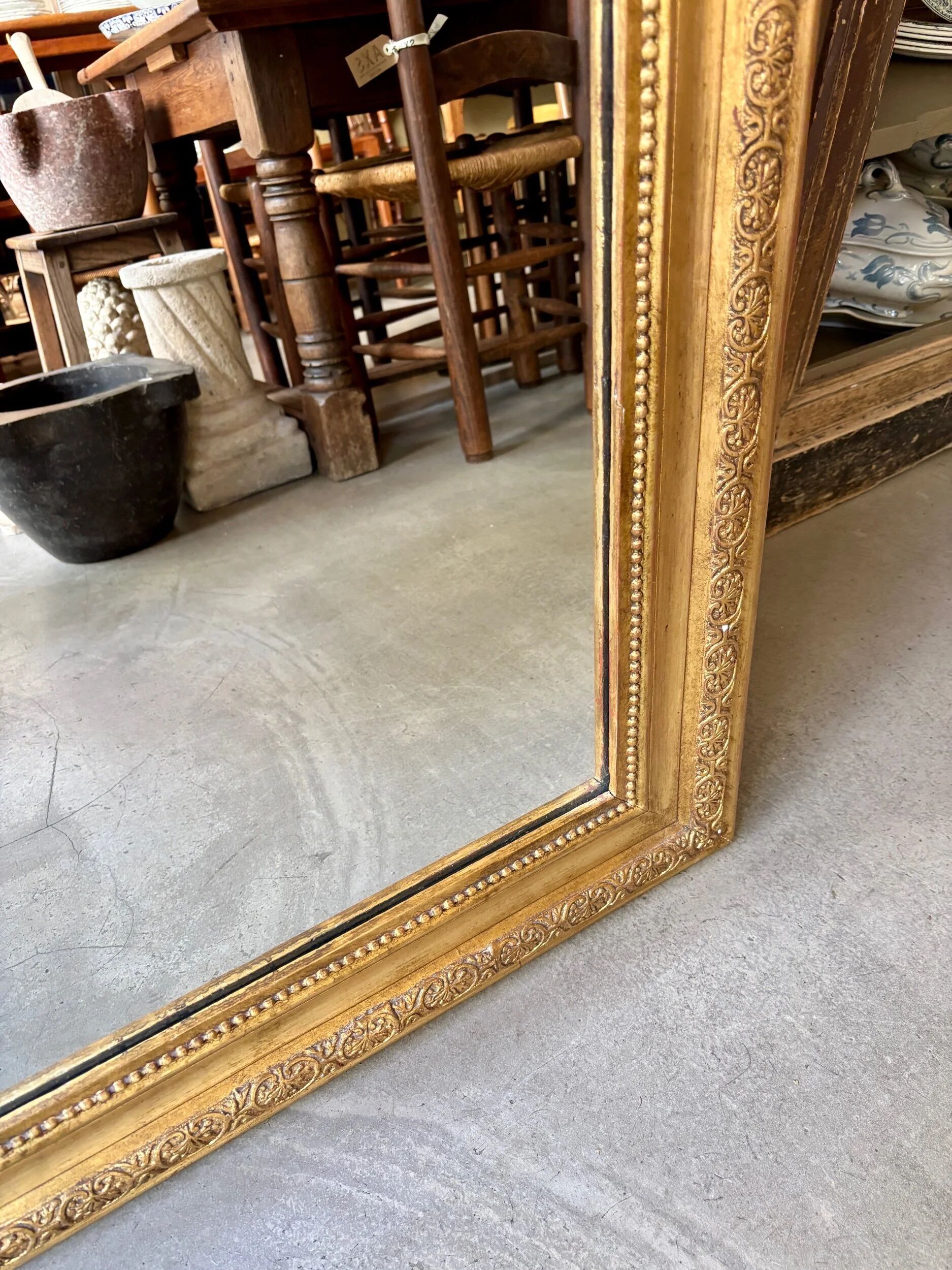 Gold sculpted and moulded stucco trumeau mirror 113 x 78 cm