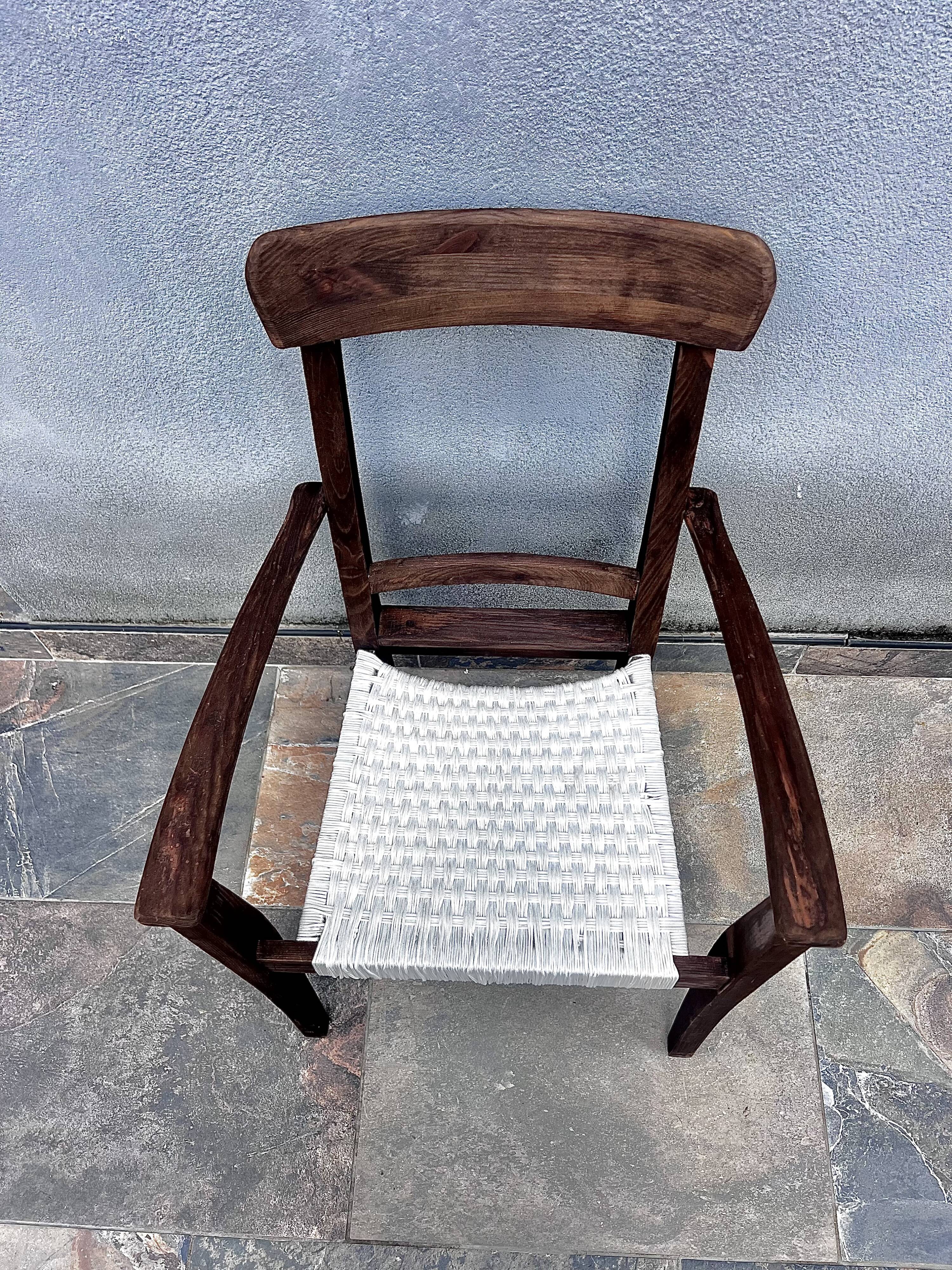 Scandinavian chair in wood and woven natural fibre.