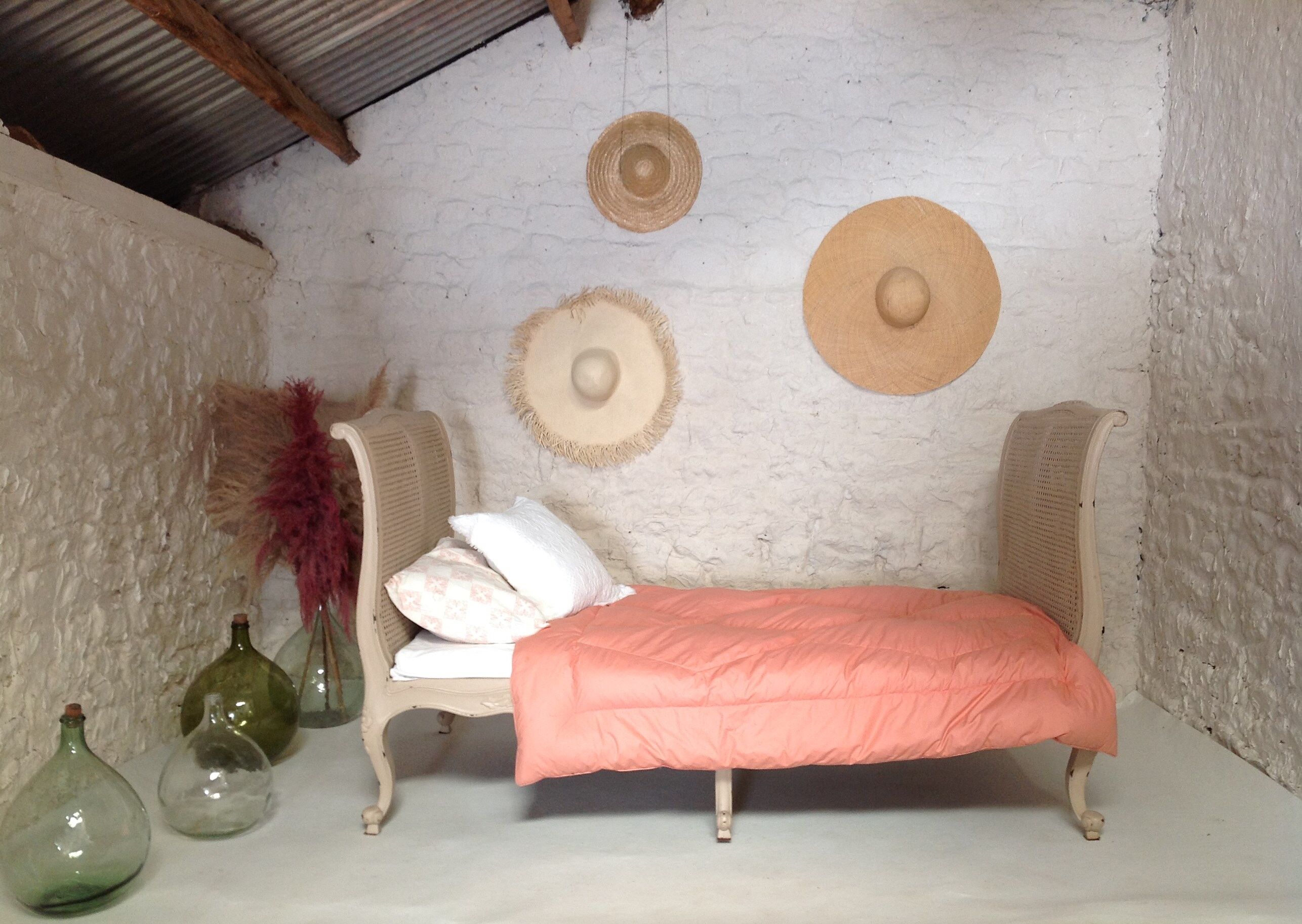 Carved wooden bench and caning bed