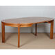 Round extendable dining table in wood published by Monopoly, 1970.
