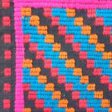 Handwoven colorful Romanian carpet, green and black background with gorgeous colorful flowers