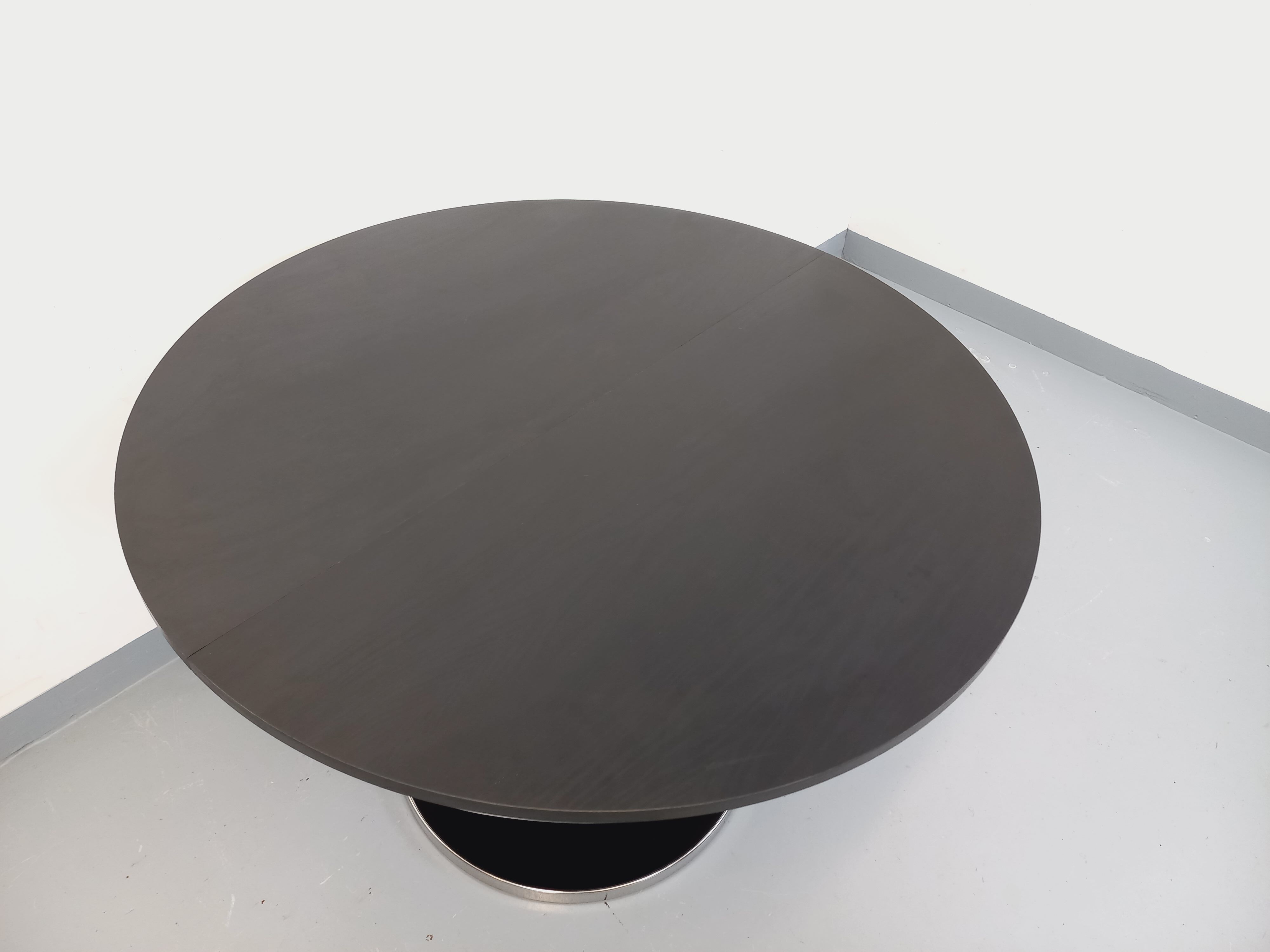 Vintage dining table in melamine with a black wood effect and chrome metal.