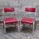 Pair of red leatherette chairs