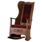 Antique English rocking chair in wood with red velvet upholstery, 19th century.