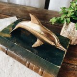 Dolphin in golden brass