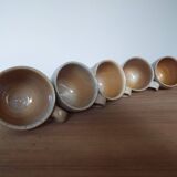 5 cups and saucers in marsh sandstone