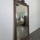 Louis XVI style mirror in carved walnut.