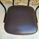 Brown faux leather armchairs