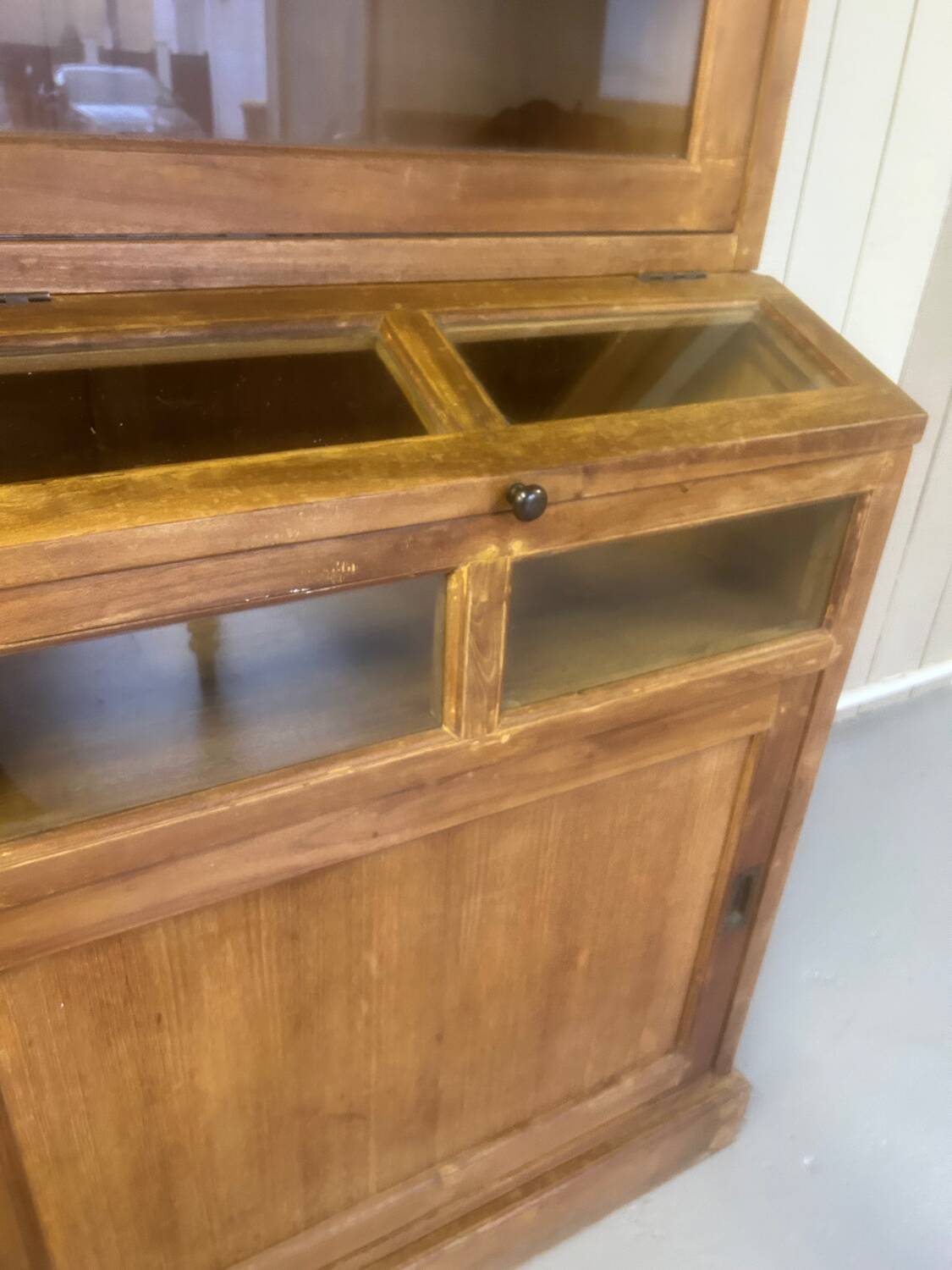 Large antique haberdashery cabinet with glass doors.