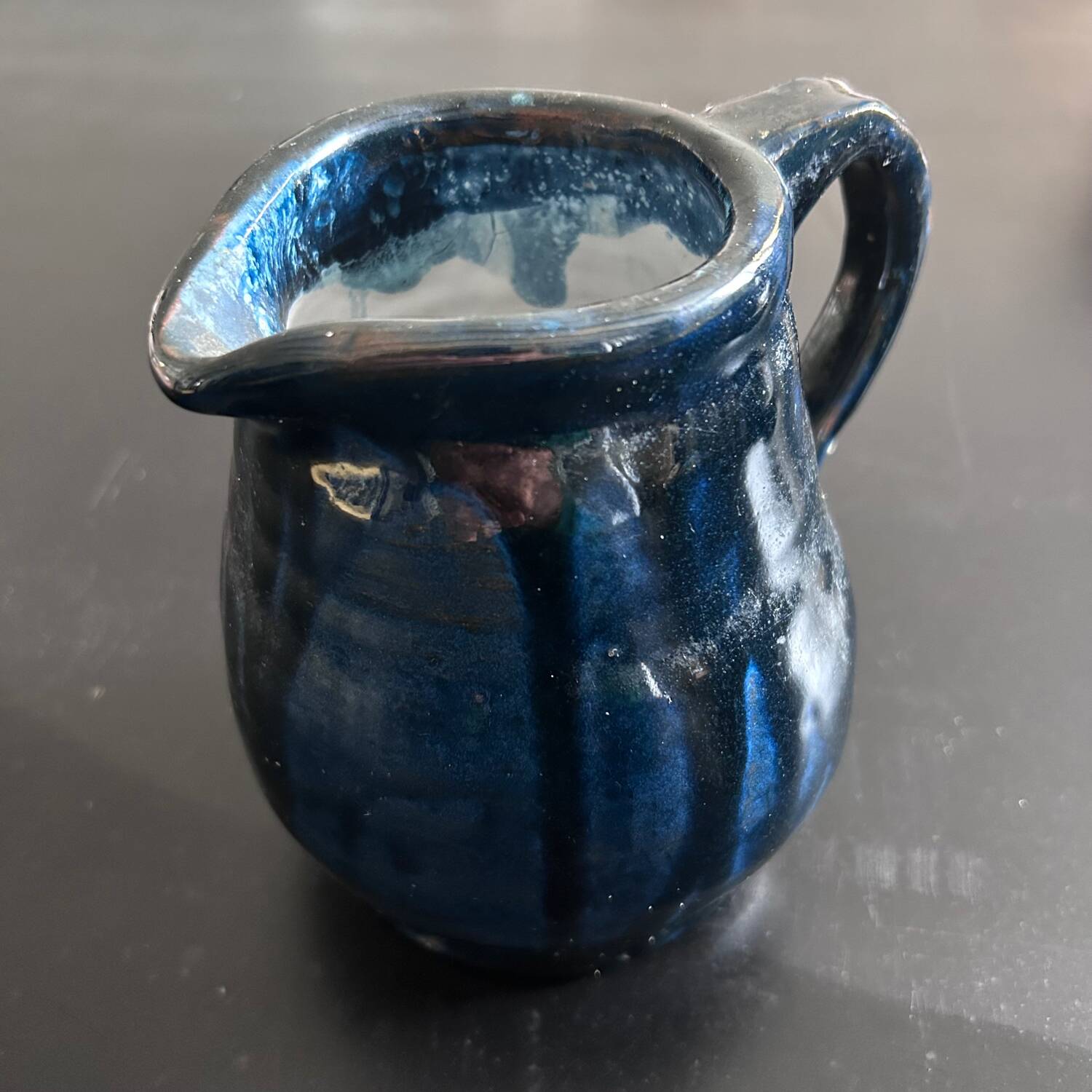 Handcrafted midnight blue pitcher signed