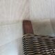 2 armchairs in woven rattan and wood, 1980s