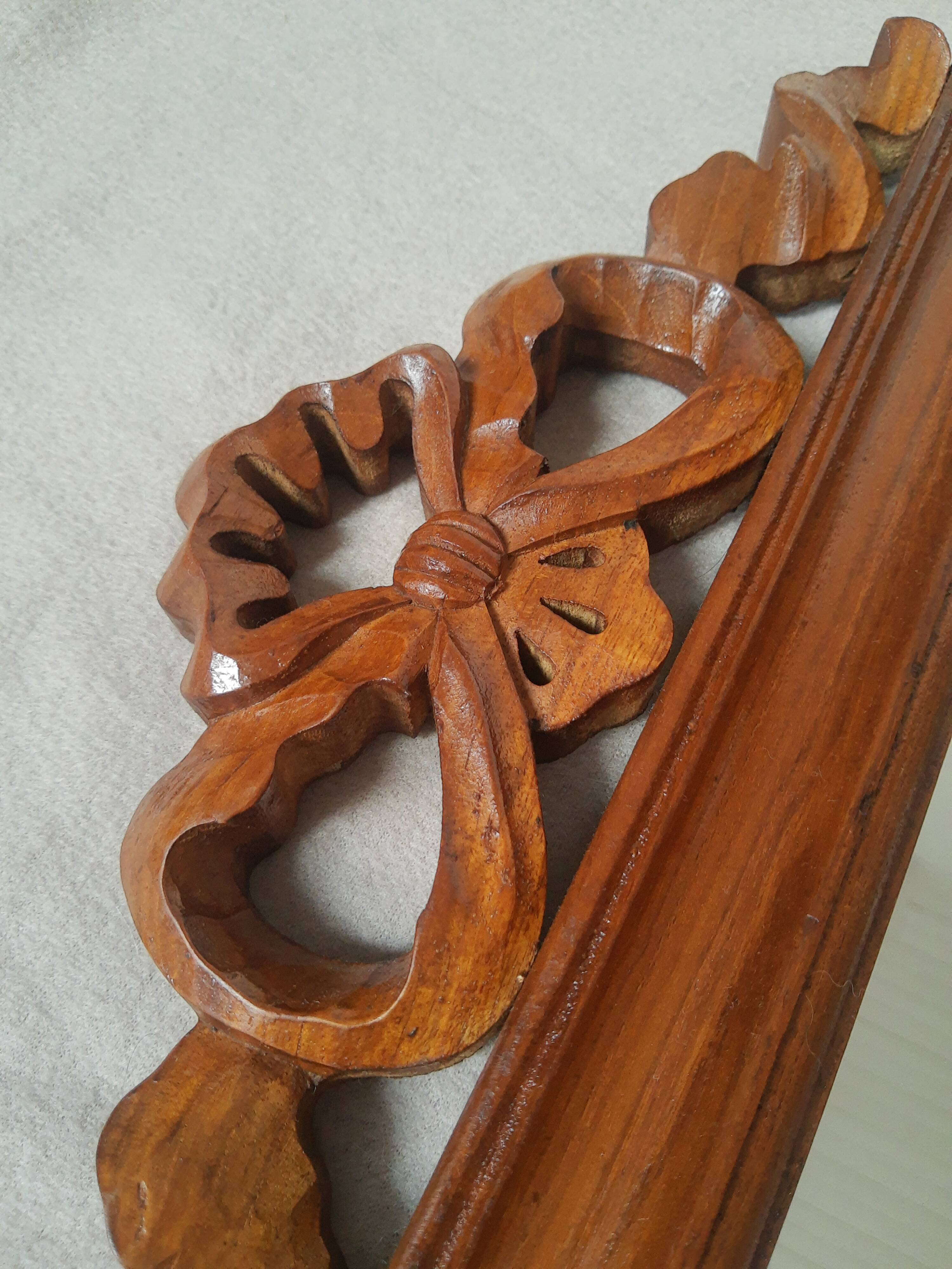 Wooden hanging mirror with vintage carved knot
