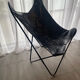 Fauteuil papillon en similicuir en parfait état