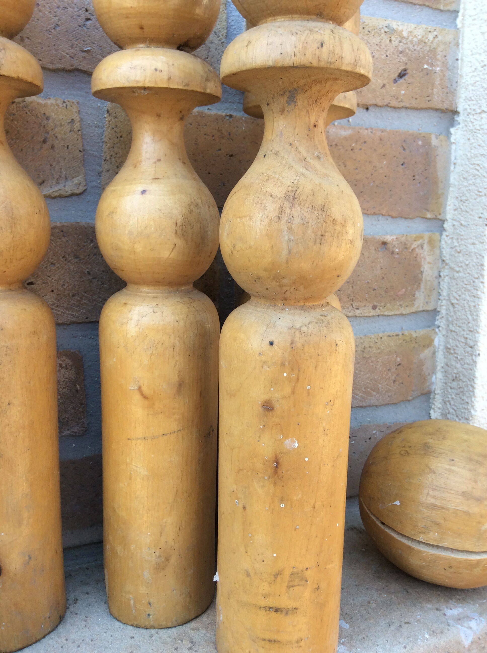 Wooden bowling and 2 vintage balls