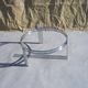 Chrome and glass tripod coffee table