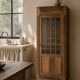 Glass-fronted cabinet from 1915, solid wood.