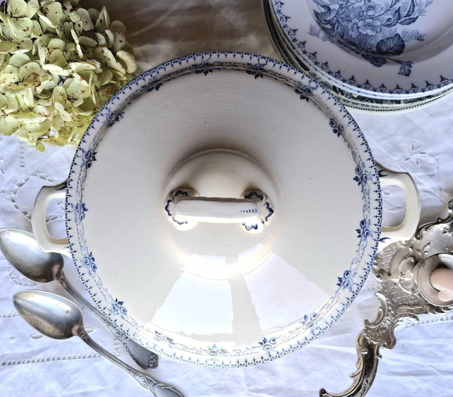 Antique mismatched earthenware soup plates with a tureen