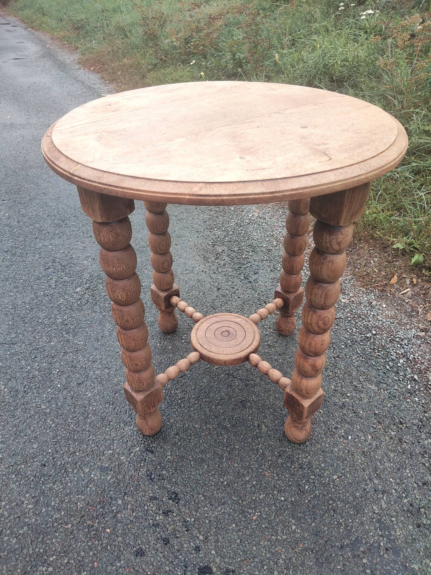 Oak gueridon in the style of Charles Dudouyt, 1940-50.