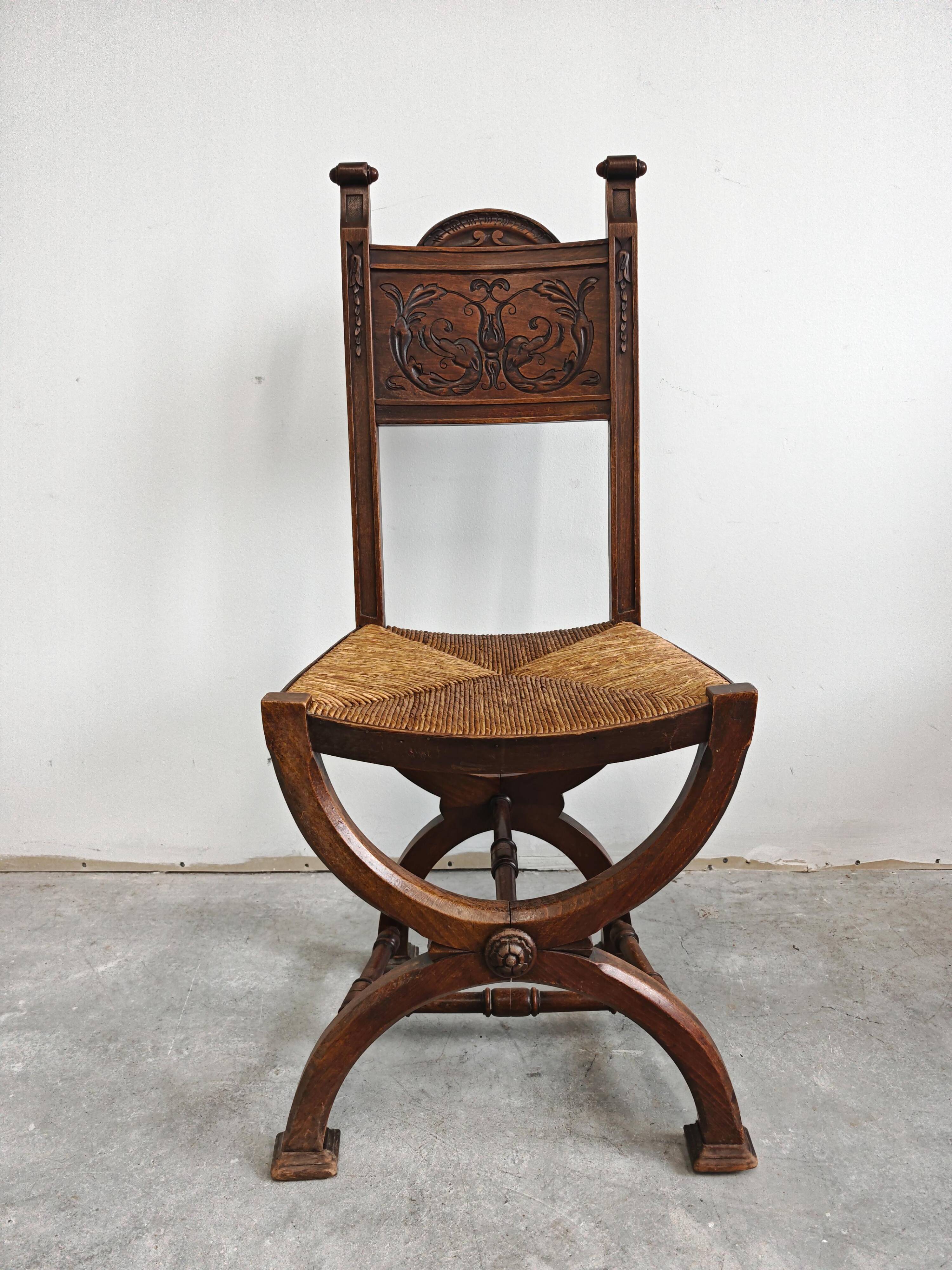 Pair of Neo-Renaissance oak chairs with straw seats, 1910