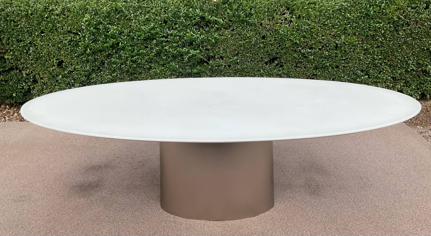 Oval designer dining table in frosted glass and brushed stainless steel