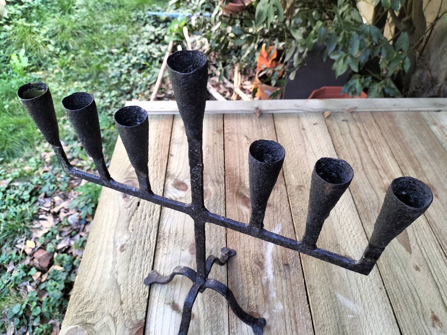 Brutalized wrought iron candle holder
