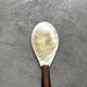 Mother-of-pearl and wood spoon