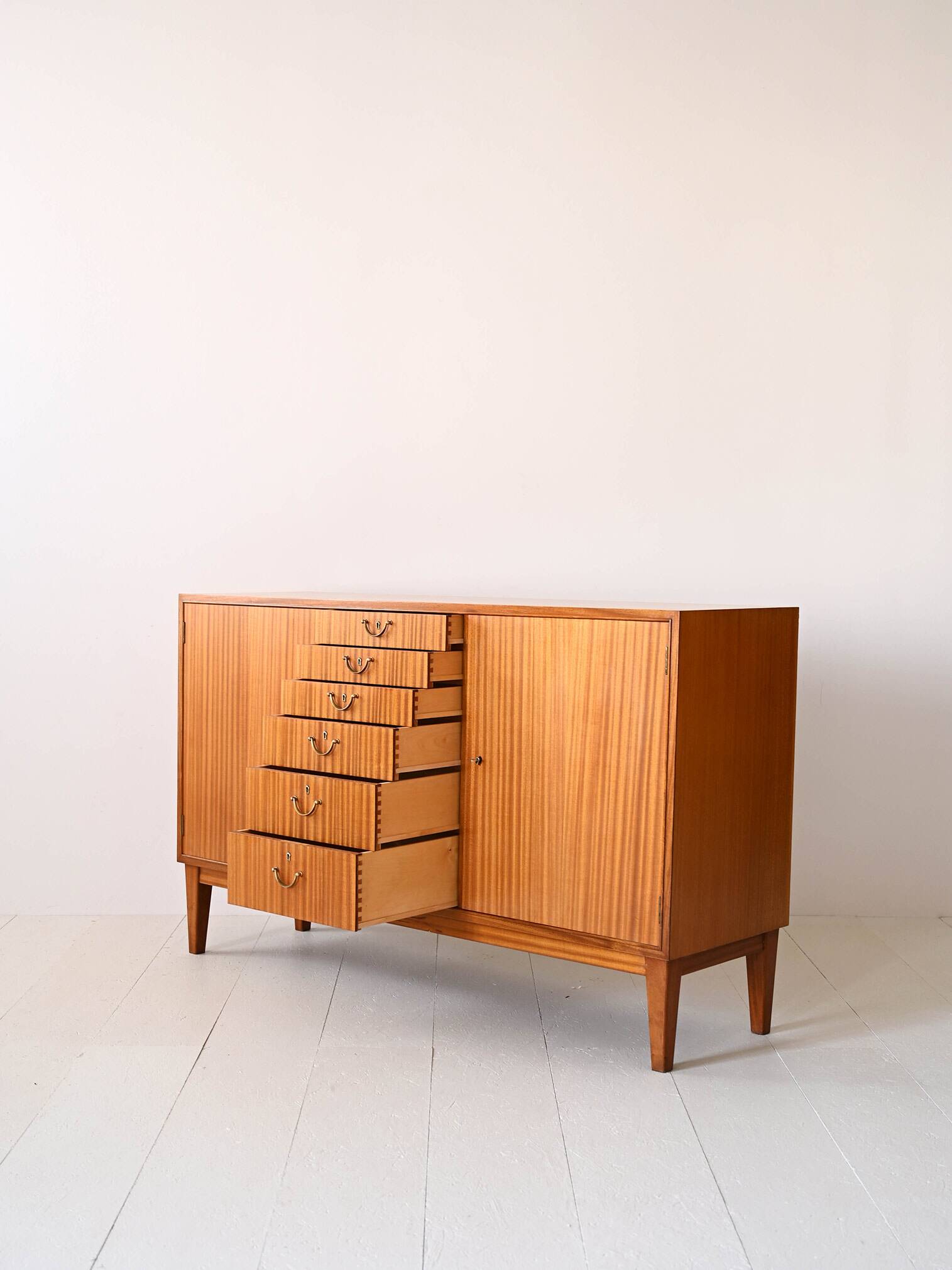 Scandinavian high sideboard with central drawers