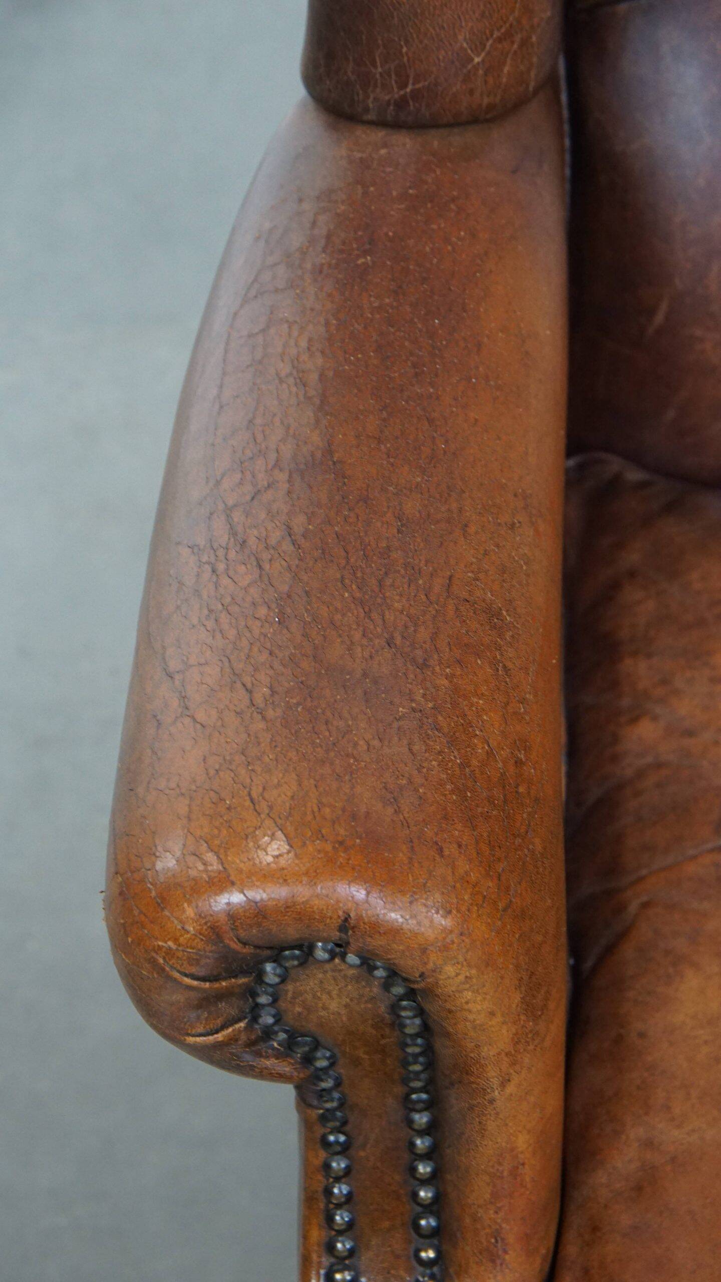 Sheepskin wingback chair in good condition