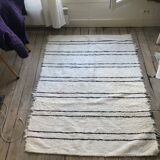 Simple carpet in ecru recycled cotton with black stripes of Berber type