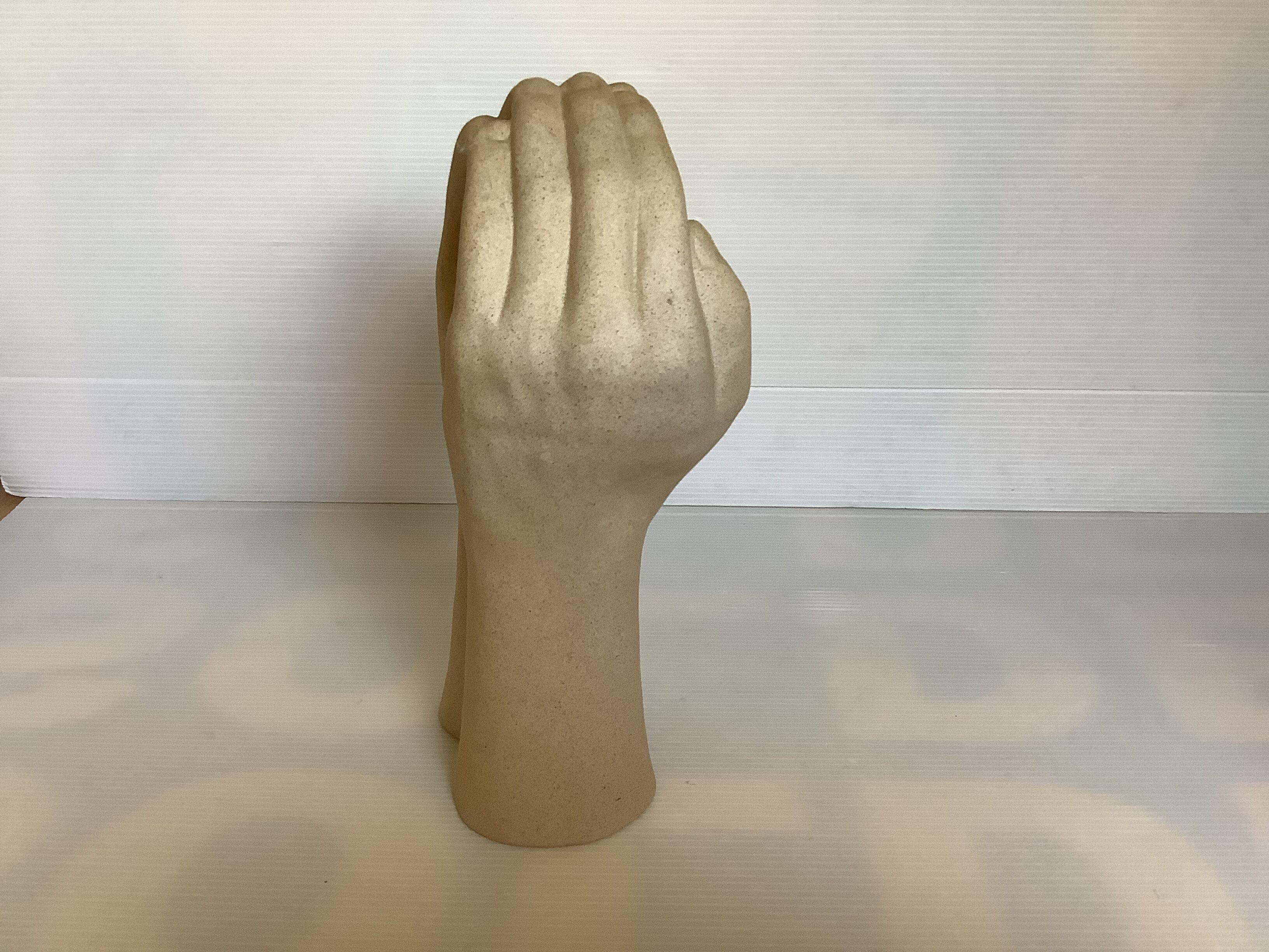 Hand-shaped candle holder