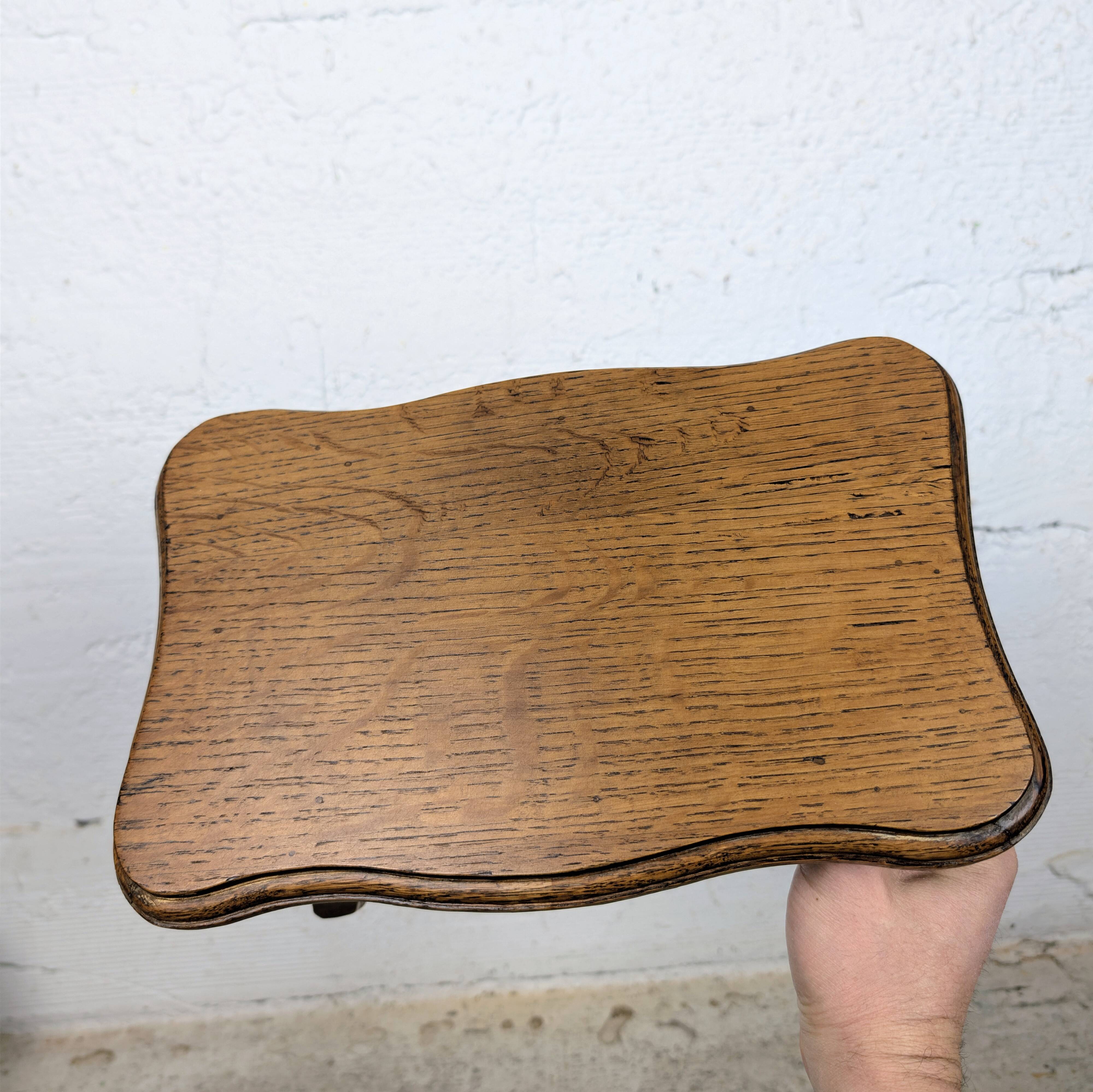 Antique footstool with rustic charm