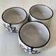 Three glazed ceramic bowls with raised graphic decoration, 1970s.