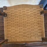 Pair of antique wooden armchairs with woven seats + cushions