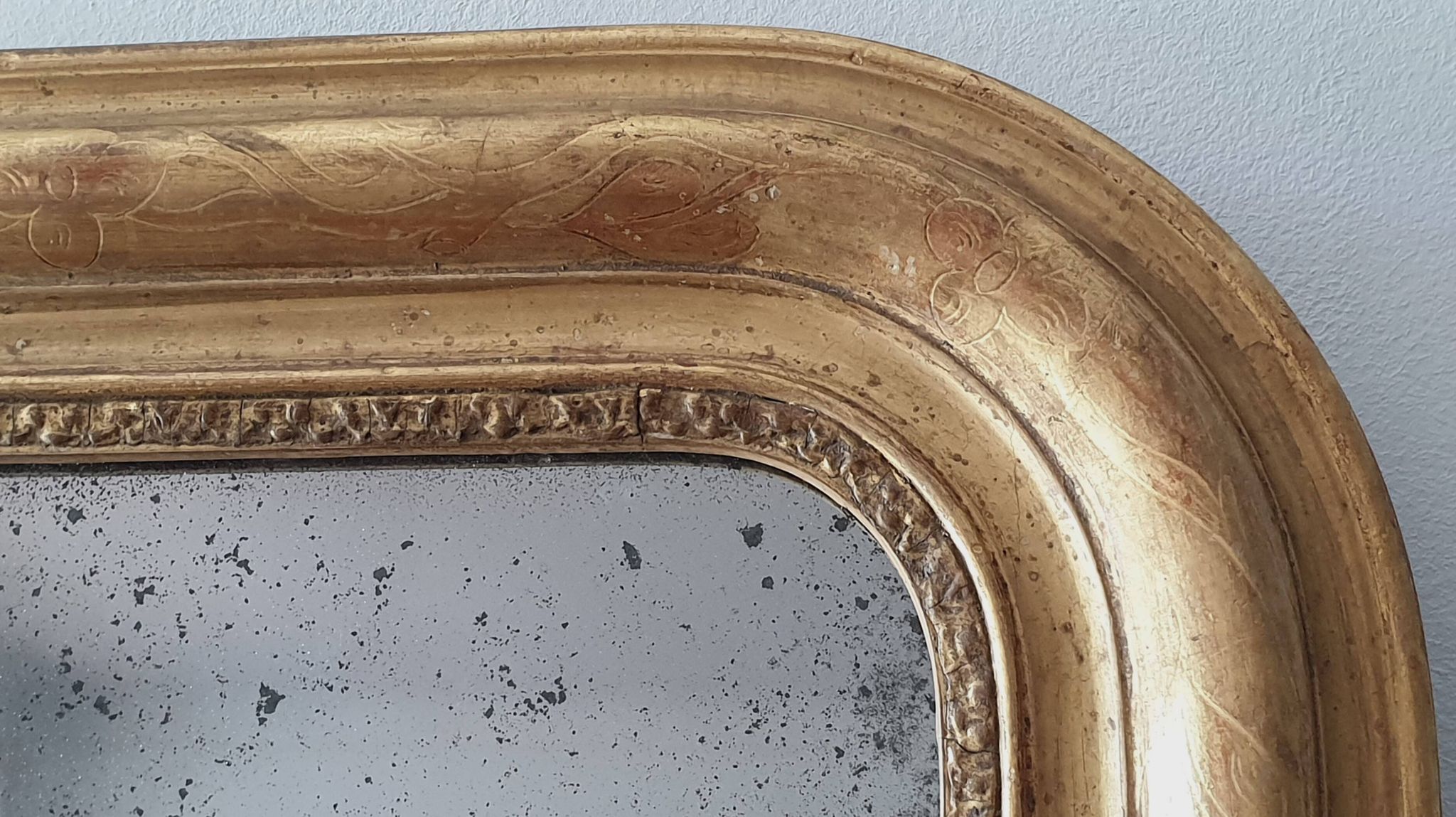 Old gilded mirror and old mercury glass - wall mirror with gold leaf