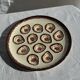 Large circular platter with compartments for shellfish, molluscs, and oysters.
