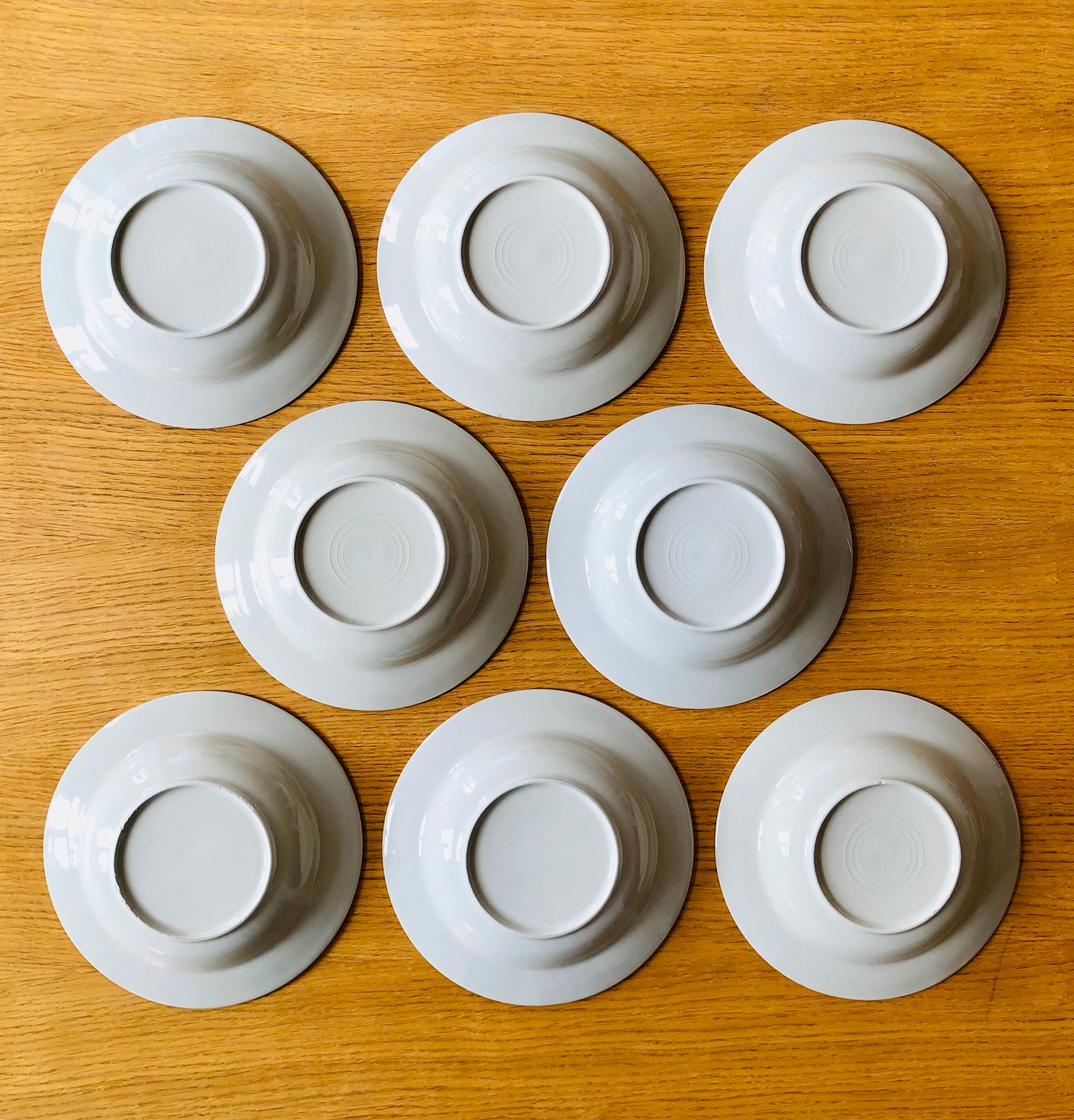Set of 8 hollow plates in speckled ceramic