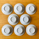 Set of 8 hollow plates in speckled ceramic