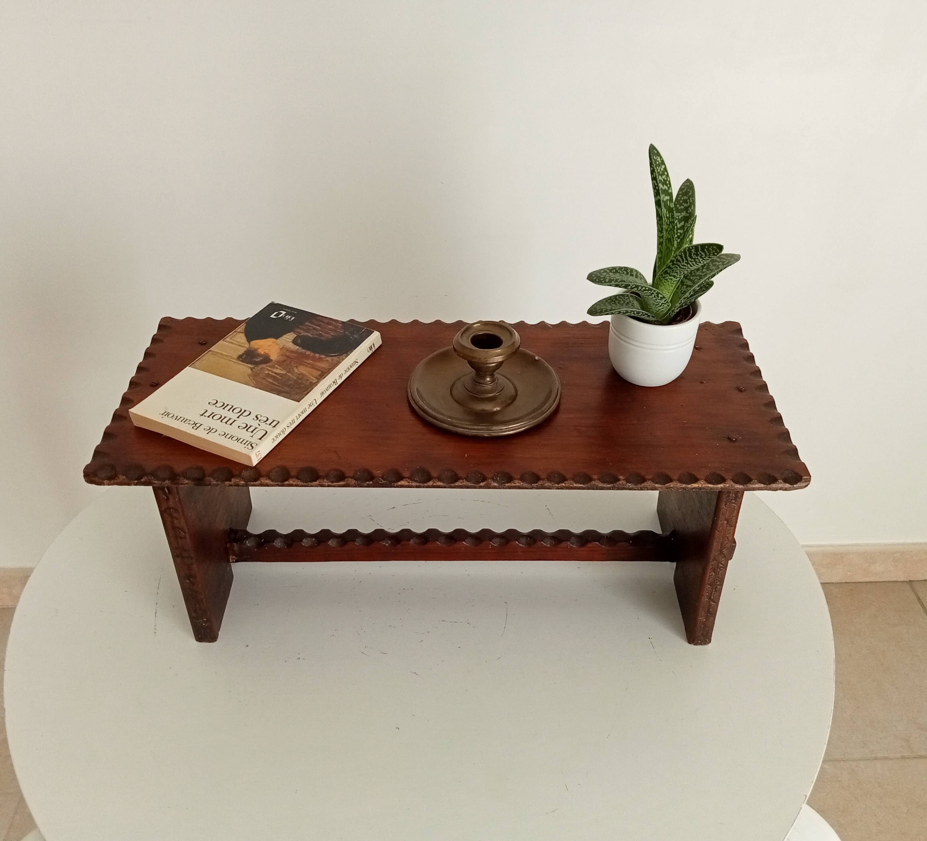 Low brutalist stool in the style of Charles Dudouyt.
