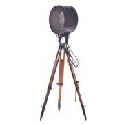 Old industrial spot on wooden tripod