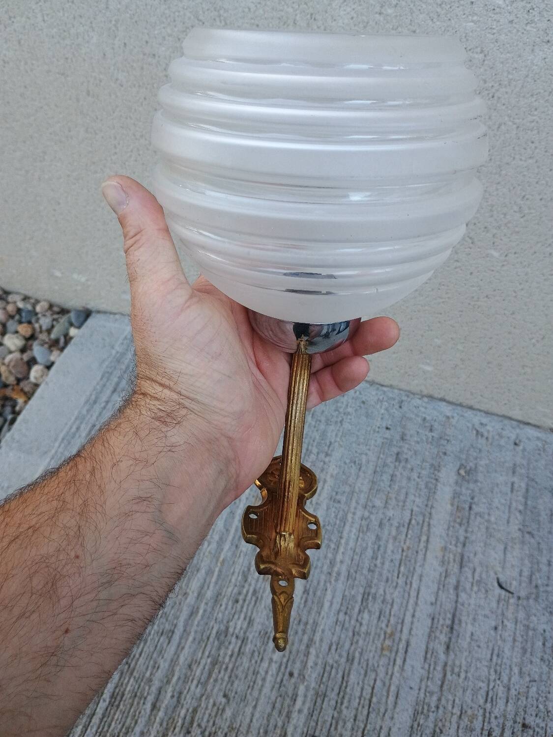 Pair of frosted glass wall lights with brass attachments, circa 1970