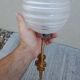 Pair of frosted glass wall lights with brass attachments, circa 1970