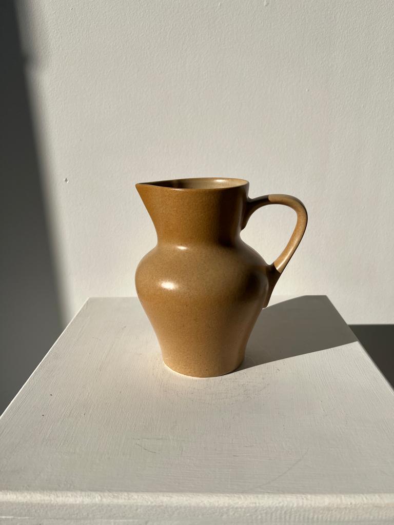 Small pitcher in light beige sandstone