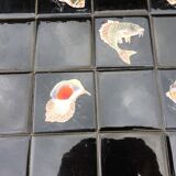 Vintage ceramic coffee table by Guy Trévoux with wrought iron base.