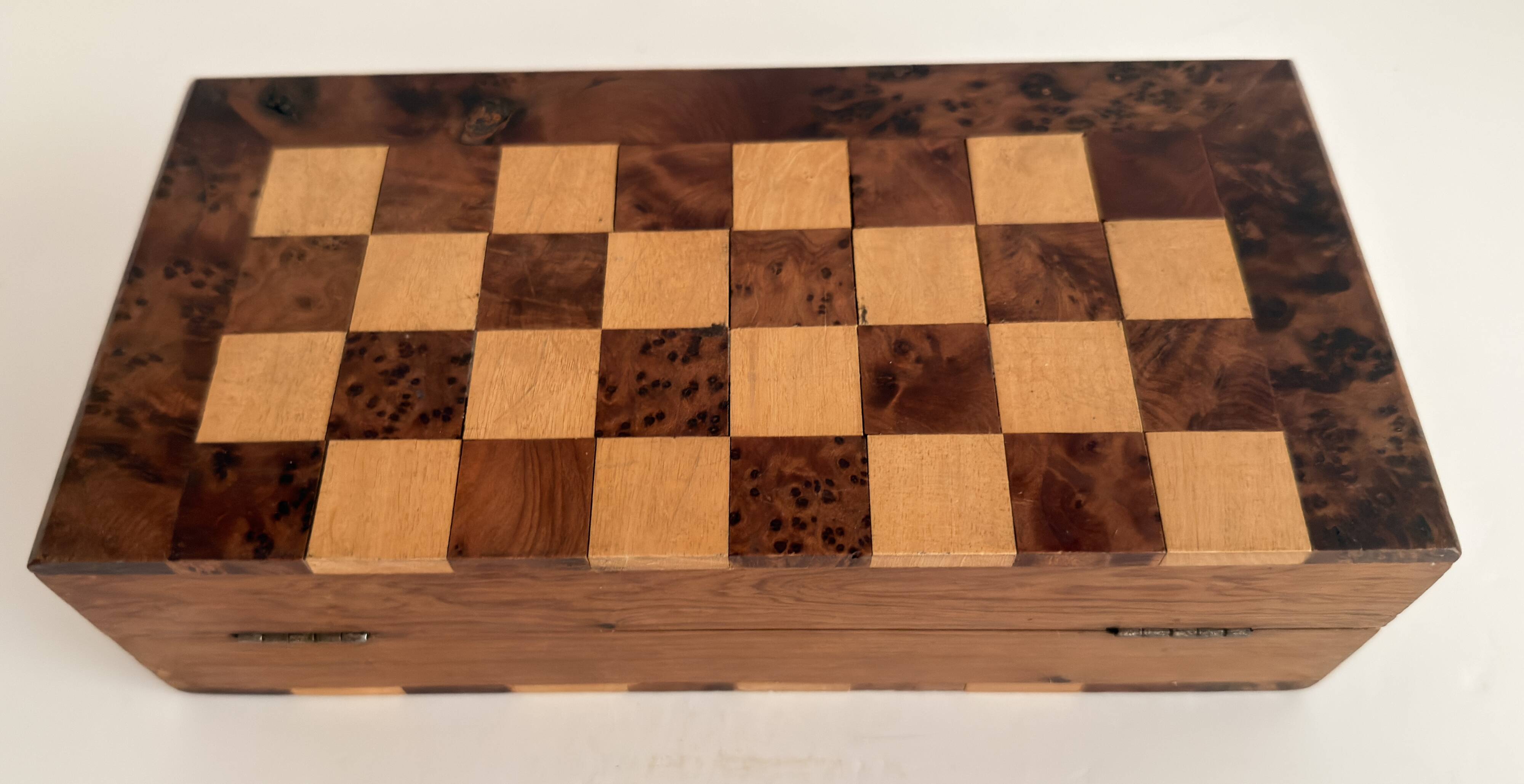 Old wooden chess set with a folding wooden box.