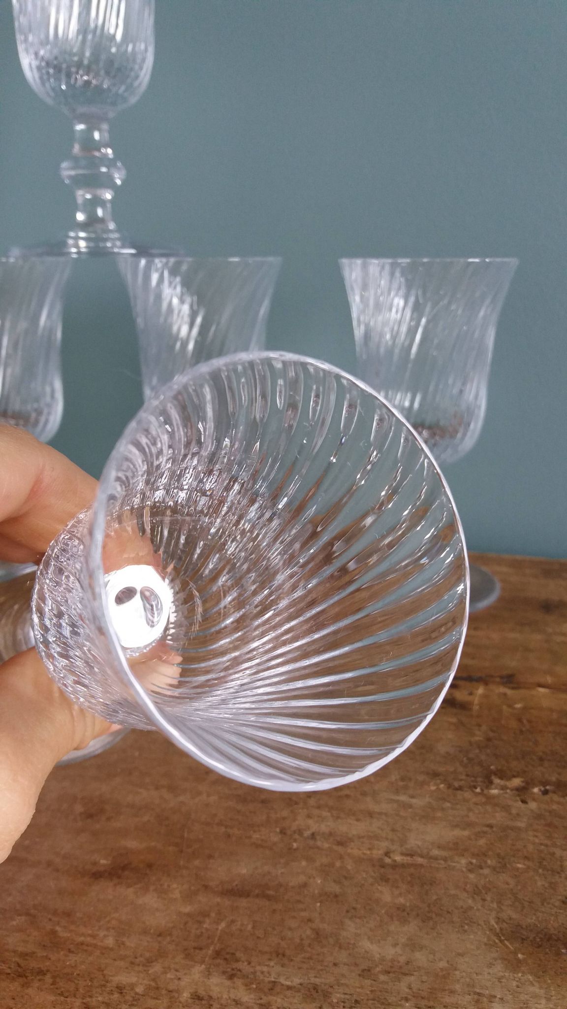 Ancient footed crystal glasses with relief twisted fluted goblets.