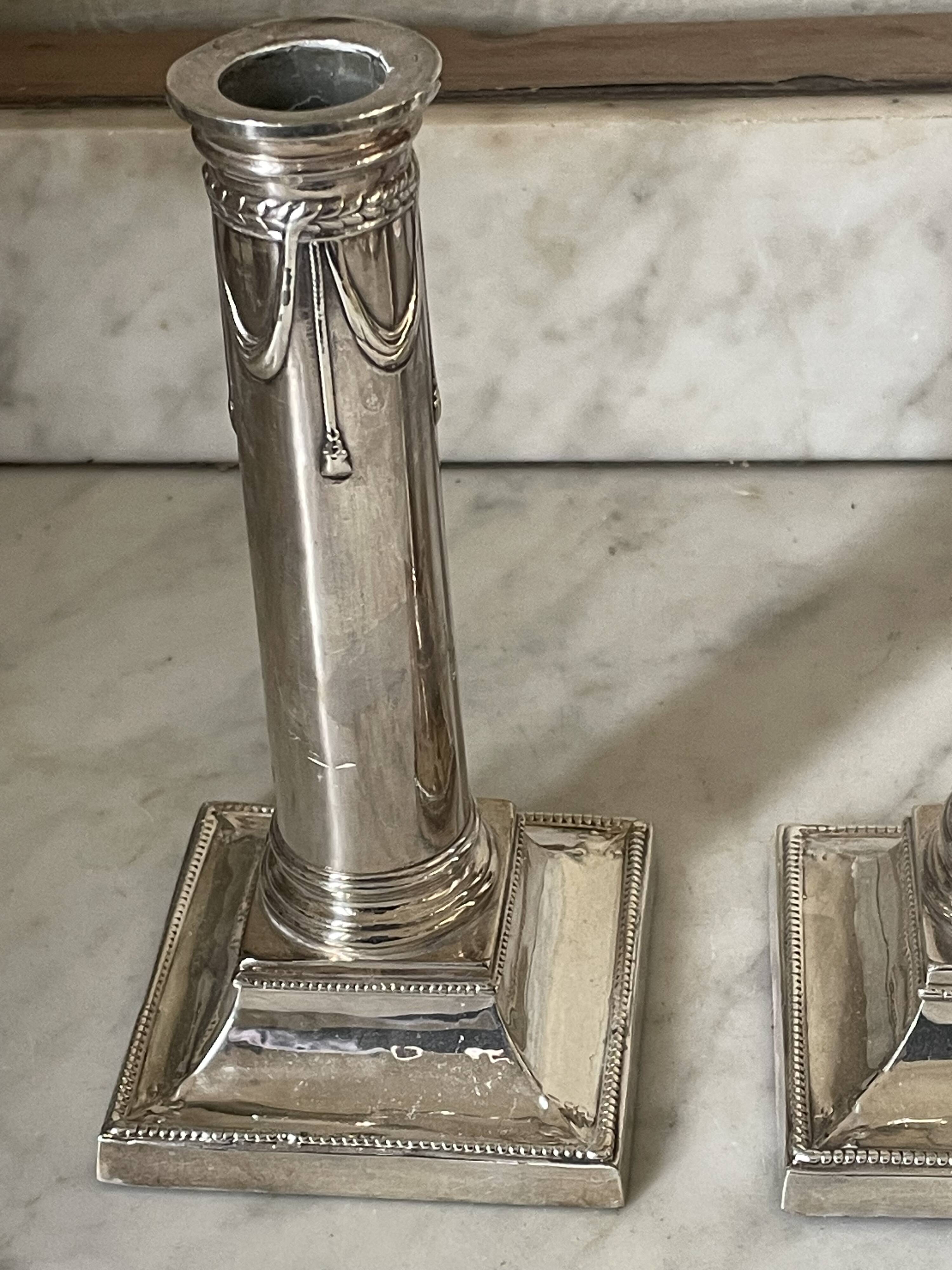 pair of Victorian style silver-plated candlesticks