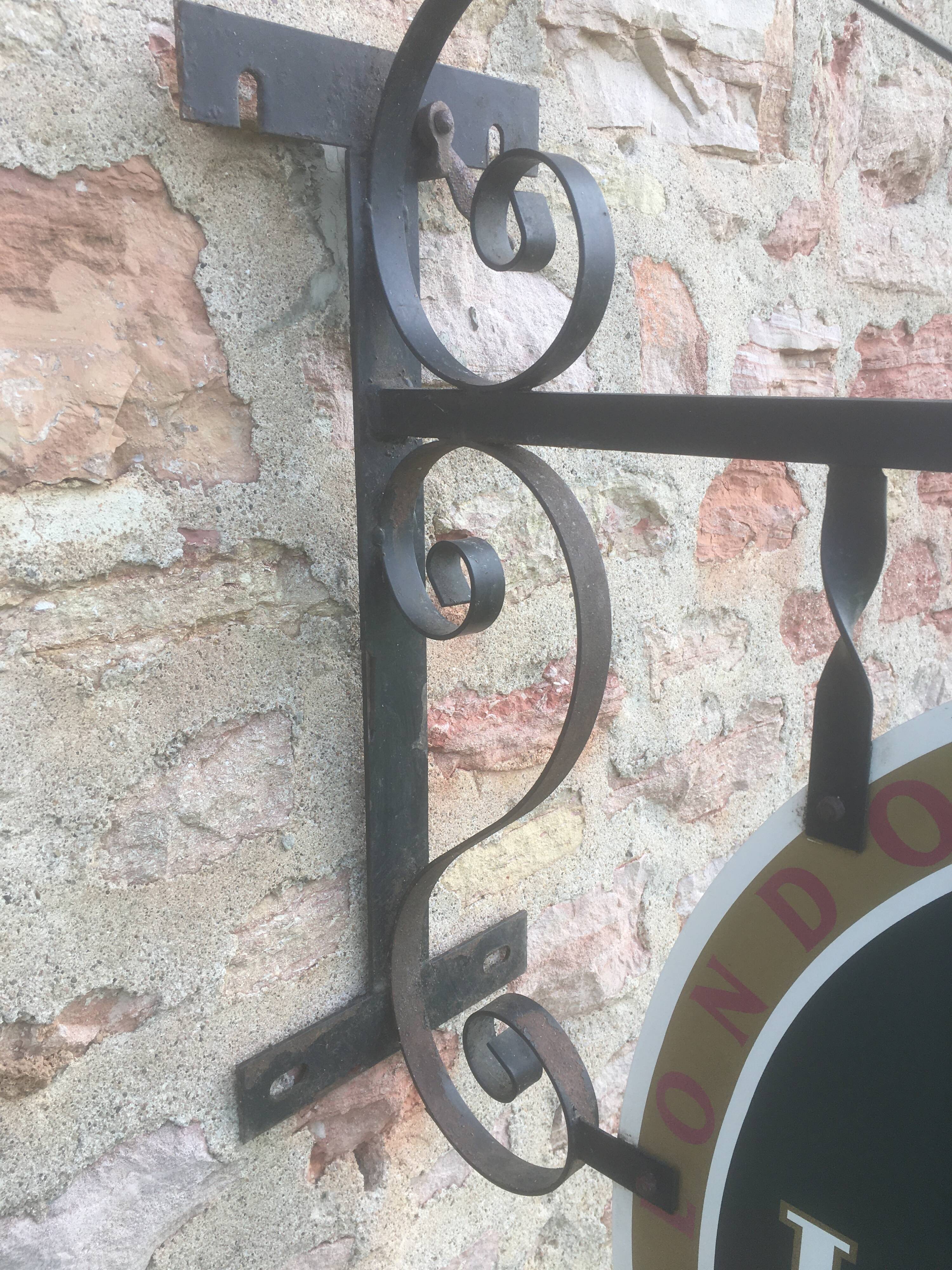 Double-sided "Loburg Beer" metal sign on wrought iron bracket