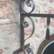 Double-sided "Loburg Beer" metal sign on wrought iron bracket
